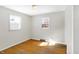 Bedroom with wood floors, two windows, baseboard heat, ceiling light at 6838 Hague Rd, Indianapolis, IN 46256