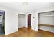 Bedroom with 3 entries, hardwood floors, and 2 large closets at 6838 Hague Rd, Indianapolis, IN 46256