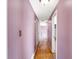 Hallway with hardwood floors offering multiple entry ways to various rooms around the home at 6838 Hague Rd, Indianapolis, IN 46256