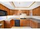 Kitchen featuring wooden cabinets and countertops, with a built-in microwave for cooking convenience at 6838 Hague Rd, Indianapolis, IN 46256