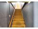 Carpeted stairway with wooden handrail leads to upper level at 6838 Hague Rd, Indianapolis, IN 46256