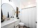 Bathroom with quartz counter, decorative mirror, and shower curtain at 720 Keck Way, Westfield, IN 46074