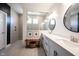 Bright bathroom featuring double sinks, mirrors, sleek lighting, and a glass-enclosed shower for a relaxing experience at 720 Keck Way, Westfield, IN 46074