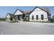 Front view of the community clubhouse featuring dedicated parking spaces and lovely landscaping at 720 Keck Way, Westfield, IN 46074