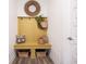 Mud room with yellow bench, accent mirror, woven basket decor at 720 Keck Way, Westfield, IN 46074