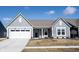 Charming single-Gathering home featuring a two-car garage, neutral siding, and well-manicured lawn at 720 Keck Way, Westfield, IN 46074