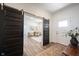 Open foyer featuring sliding barn door entry to sitting room, and beautiful natural light at 720 Keck Way, Westfield, IN 46074