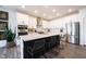Modern kitchen with stainless steel appliances, a large island, and wood flooring at 720 Keck Way, Westfield, IN 46074