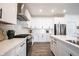 Stylish kitchen features white cabinets, stainless steel appliances, and a large island at 720 Keck Way, Westfield, IN 46074