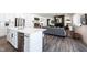 Open concept kitchen with island flowing into a spacious living room at 720 Keck Way, Westfield, IN 46074