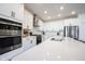Close up of a modern white kitchen featuring stainless steel appliances and sleek countertops at 720 Keck Way, Westfield, IN 46074