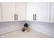 Modern kitchen detail with white cabinets, backsplash, and neutral countertops at 720 Keck Way, Westfield, IN 46074