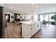 Open concept kitchen island view looking into a spacious living room and dining area at 720 Keck Way, Westfield, IN 46074