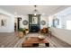 Living room with a stylish fireplace, comfortable seating, and modern lighting fixture at 720 Keck Way, Westfield, IN 46074