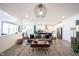 Open-concept living room with modern kitchen, showcasing contemporary design and comfortable furniture at 720 Keck Way, Westfield, IN 46074