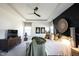 Spacious main bedroom featuring a black accent wall, carpeted floor and a ceiling fan for a modern retreat at 720 Keck Way, Westfield, IN 46074
