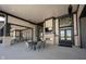 Covered patio area with fireplace, seating, and a view of the manicured outdoor space at 720 Keck Way, Westfield, IN 46074