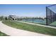 People enjoying a game of pickleball on a sunny day at the community court, surrounded by well-maintained landscaping at 720 Keck Way, Westfield, IN 46074