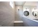 Modern bathroom featuring a tiled walk-in shower with a bench for a comfortable and relaxing experience at 720 Keck Way, Westfield, IN 46074