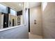 Modern walk-in shower with sleek tilework, a handheld showerhead, and a window for natural light at 720 Keck Way, Westfield, IN 46074