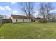 Spacious backyard view with well-maintained lawn and a charming gazebo, great for outdoor enjoyment at 7579 Allenwood Ct, Indianapolis, IN 46268