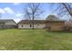 Home with a well-maintained yard and screened-in gazebo at 7579 Allenwood Ct, Indianapolis, IN 46268