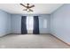 Comfortable bedroom offers a blank canvas with plush carpet and a window for natural light at 7579 Allenwood Ct, Indianapolis, IN 46268