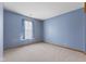 Neutral bedroom features carpet, a window, and ample space to make your own at 7579 Allenwood Ct, Indianapolis, IN 46268