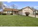 Charming single-story home with a well-manicured lawn and inviting curb appeal at 7579 Allenwood Ct, Indianapolis, IN 46268