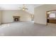 Bright living room with a brick fireplace, neutral carpet, and vaulted ceilings at 7579 Allenwood Ct, Indianapolis, IN 46268