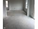 A large, open living room with bright natural light from the windows at 7622 Sebastian Pl, Indianapolis, IN 46239