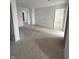 Spacious living room with multiple doorways, ideal for a versatile living space at 7622 Sebastian Pl, Indianapolis, IN 46239