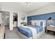 Stylish bedroom with an en-suite closet, aviation-themed wallpaper, and a sleek, blue accent wall at 8148 Ebaugh Dr, Camby, IN 46113