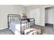 Cozy bedroom featuring a metal bed frame, and storage shelves at 8148 Ebaugh Dr, Camby, IN 46113