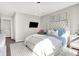 Comfortable bedroom with a stylish upholstered bed, framed artwork, and a modern TV for entertainment at 8148 Ebaugh Dr, Camby, IN 46113