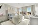 Bright bedroom with a tufted headboard, a crystal chandelier, and large windows providing natural light at 8148 Ebaugh Dr, Camby, IN 46113