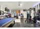 Finished garage space with a pool table, exercise equipment and bike racks at 8148 Ebaugh Dr, Camby, IN 46113