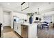 Bright kitchen featuring white cabinets, stainless steel appliances, and island with a sink at 8148 Ebaugh Dr, Camby, IN 46113