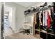 Spacious walk-in closet with custom shelving, a vanity area, and an organized layout for clothing storage at 8148 Ebaugh Dr, Camby, IN 46113