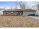 Charming single-story home with a brick facade and an attached garage at 817 Delray Dr, Indianapolis, IN 46241