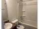 Standard bathroom featuring a single sink vanity and a shower-tub combo with white tile and built-in shelving at 8412 Pippen Pl, Camby, IN 46113