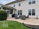Exterior view of the home featuring a patio and screened in porch at 8654 Arailia Dr, Plainfield, IN 46168