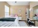 Well-lit bedroom with a comfy bed, a functional nightstand, and a modern mirror for getting ready at 8654 Arailia Dr, Plainfield, IN 46168