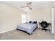 Inviting bedroom with a ceiling fan, desk, and bright window, perfect for relaxation or study at 8654 Arailia Dr, Plainfield, IN 46168