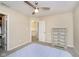Comfortable bedroom with a ceiling fan and a wood dresser illuminated by natural light at 8654 Arailia Dr, Plainfield, IN 46168