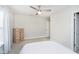 Inviting bedroom with a ceiling fan and a wood dresser illuminated by natural light at 8654 Arailia Dr, Plainfield, IN 46168