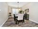 Formal dining room with wood floors, modern chandelier, and natural light at 8654 Arailia Dr, Plainfield, IN 46168