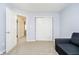 Comfortable room featuring sliding closet doors and a cozy couch for relaxing and entertaining at 8654 Arailia Dr, Plainfield, IN 46168