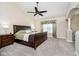 Spacious main bedroom with vaulted ceiling, ceiling fan, and neutral carpet at 8654 Arailia Dr, Plainfield, IN 46168
