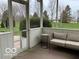 Cozy screened porch featuring an outdoor couch, perfect for relaxing at 8654 Arailia Dr, Plainfield, IN 46168
